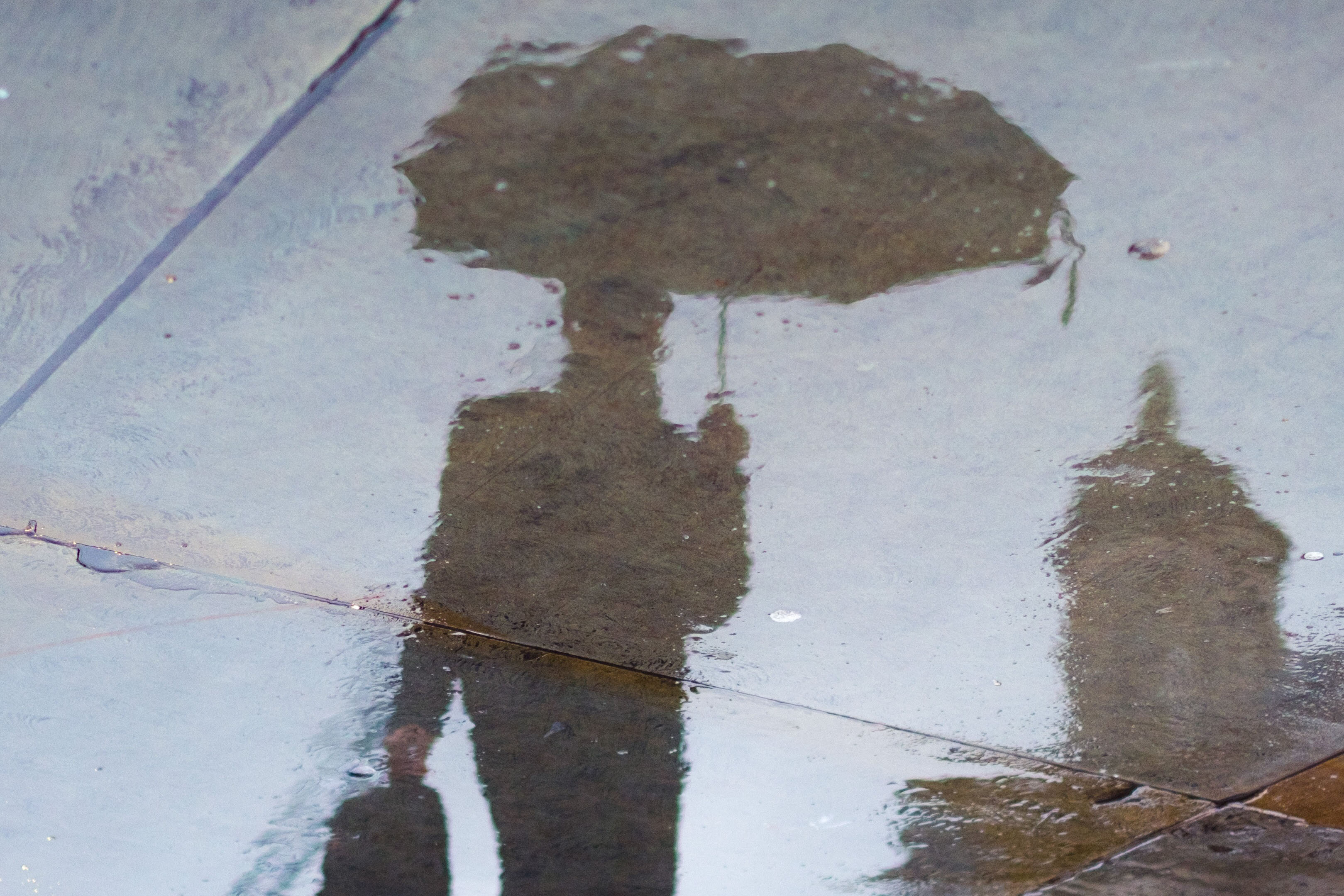 Shadow of man walking in the rain