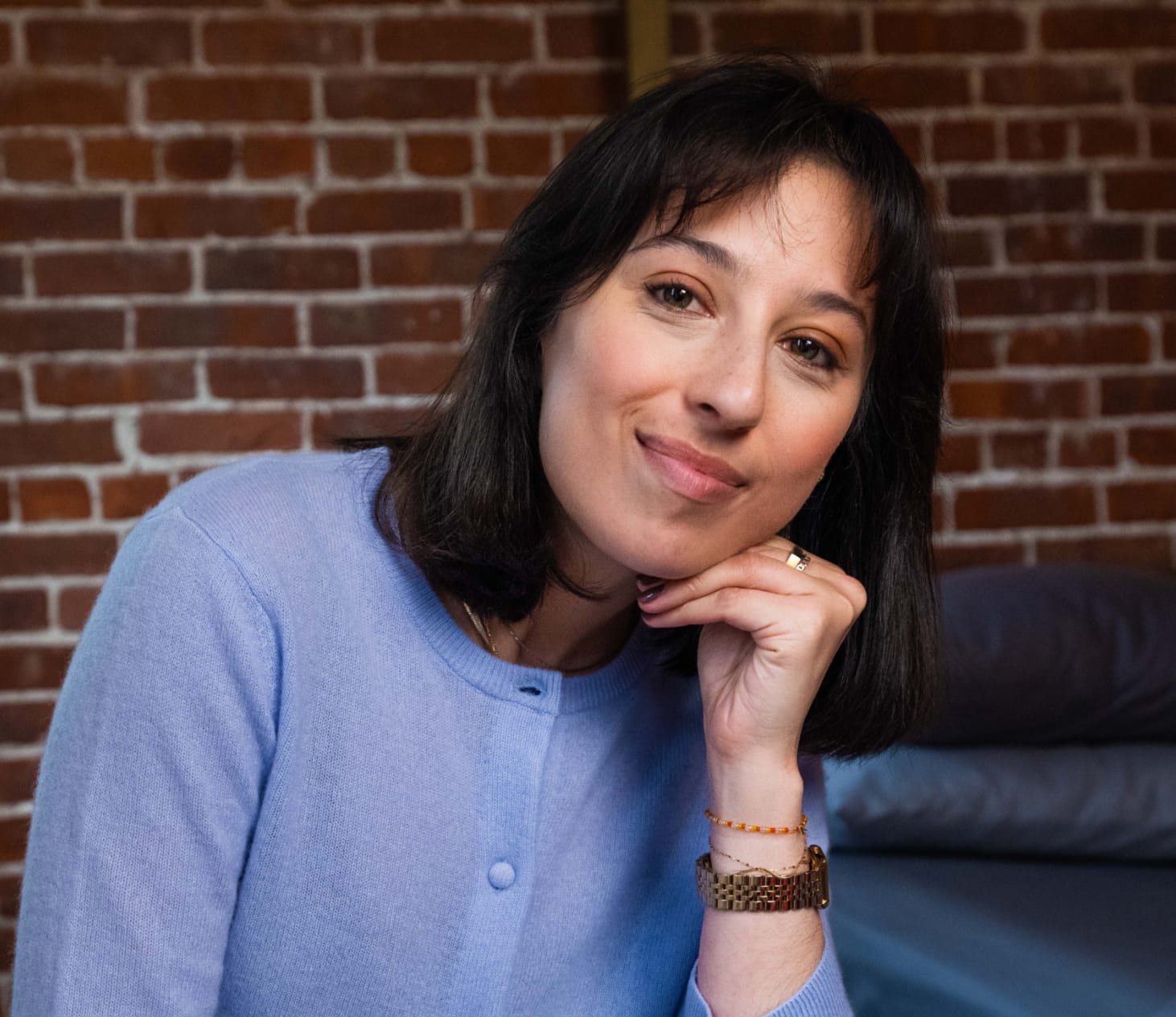 woman holding head on her hand