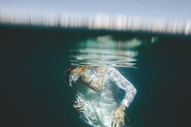 A couple embracing under water