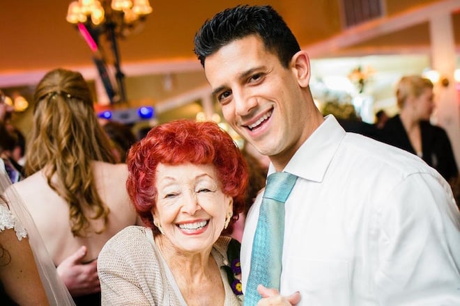 A man dances with a family member