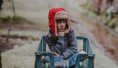 kid sitting outside looking puzzled