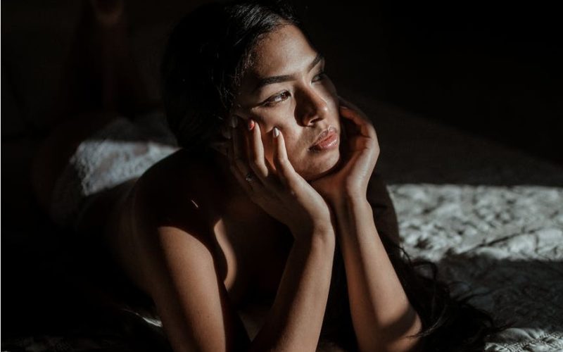 girl in darkness looking out