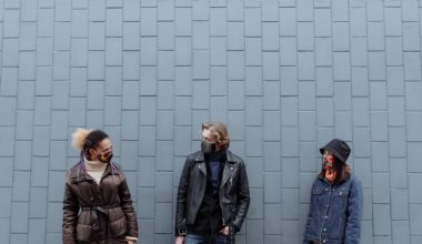 three people awkwardly standing together