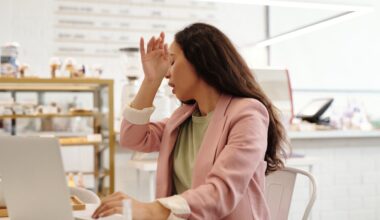 woman-covering-her-sneeze-at-work